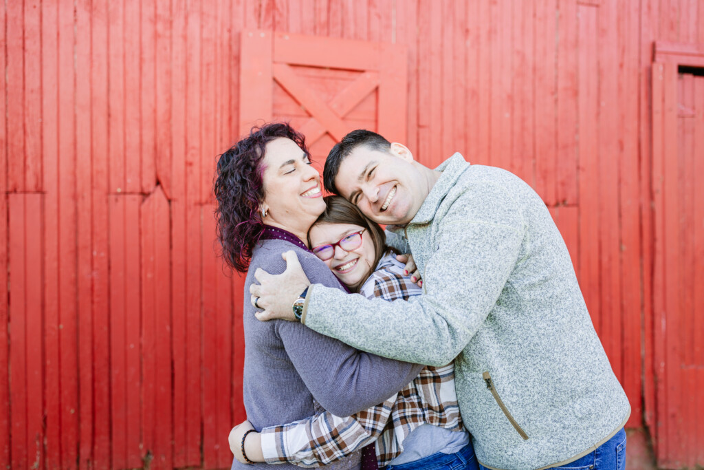 Family photography session at a red barn by Christy Rice Photography
