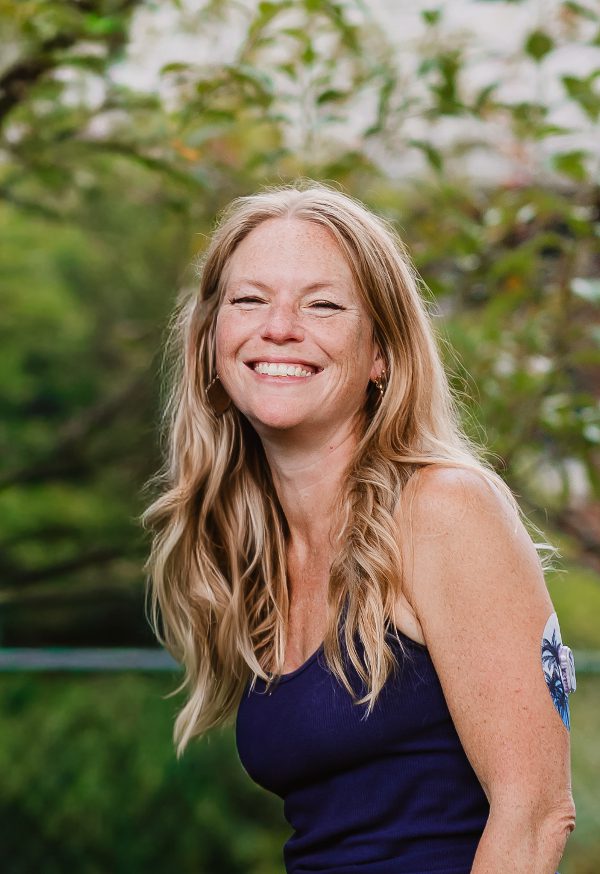 Christy Rice of Christy Rice Photography smiling in a garden in Westerville, Ohio.